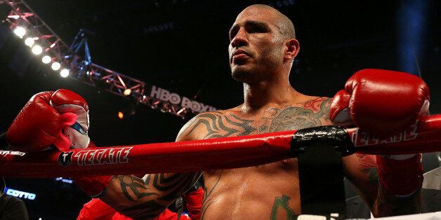 ORLANDO, FL - OCTOBER 05: Miguel Cotto reacts to winning a Super Welterweight bout against Delvin Rodriguez at Amway Center on October 5, 2013 in Orlando, Florida. (Photo by Mike Ehrmann/Getty Images)