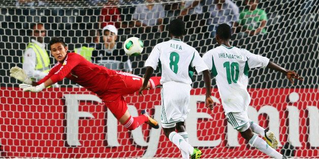 ABU DHABI, UNITED ARAB EMIRATES - NOVEMBER 08: Kelechi Iheanacho #10 of Nigeria scores his team's second goal against goalkeeper Raul Gudino of Mexico during the FIFA U-17 World Cup UAE 2013 Final between Nigeria and Mexico at Mohamed Bin Zayed Stadium on November 8, 2013 in Abu Dhabi, United Arab Emirates. (Photo by Alex Grimm - FIFA/FIFA via Getty Images)