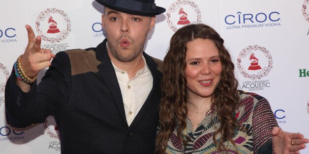 FILE - In this Sept. 5, 2013 file photo, Mexican singing pop duo Jesse & Joy pose for photographers on the red carpet, upon their arrival to a Latin Grammy Acoustic Session, at a local theater, in Mexico City. The duo has dedicated the song ?Corazón de Campeon? to Mexico?s national soccer team which is competing to qualify for the 2014 World Cup. (AP Photo/Marco Ugarte)