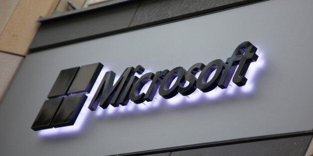A logo sits on display outside Microsoft Corp.'s new store in Berlin, Germany, on Thursday, Nov. 7, 2013. Microsoft Corp.'s board placed Chief Operating Officer Kevin Turner on a three-person list of internal candidates to replace departing Chief Executive Officer Steve Ballmer, said a person with knowledge of the process. Photographer: Krisztian Bocsi/Bloomberg via Getty Images