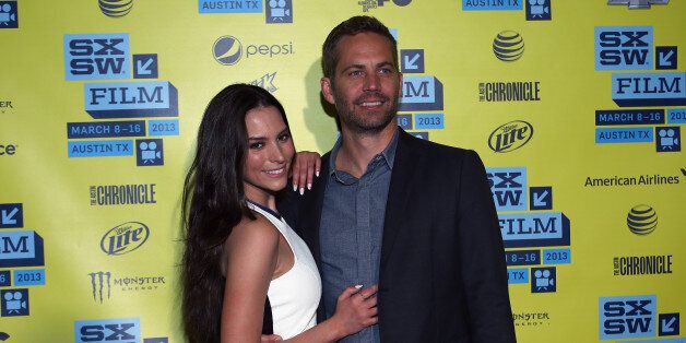 AUSTIN, TX - MARCH 10: Actors Genesis Rodriguez and Paul Walker arrive at the screening of 'Hours' during the 2013 SXSW Music, Film + Interactive Festival at Topfer Theatre at ZACH on March 10, 2013 in Austin, Texas. (Photo by Waytao Shing/Getty Images for SXSW)