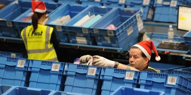 Workers prepare orders for delivery at the Argos distribution centre, Barton Business Park, Burton-on-Trent.