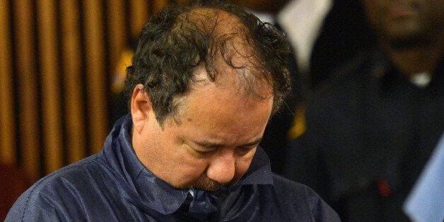 (FILES)Ariel Castro is arraigned at Cleveland Municipal Court for the kidnapping of three women in this May 9, 2013 file photo in Cleveland, Ohio. The Ohio man accused of holding three young US women captive for around a decade in a house in Cleveland will plead not guilty to charges of rape and kidnapping, one of his lawyers said May 15, 2013. 'There will be a plea of not guilty,' attorney Jaye Schlachet told AFP. Schlachet would not say on what grounds Ariel Castro would plead not guilty in the case that has shocked America, urging the public to refrain from a rush to judgment of his client. 'He's not a monster and he shouldn't be demonized by the media,' the lawyer said. The 52-year-old, who is being held on an $8 million bond, has been charged with kidnapping and raping three women over around a 10-year period, one of whom bore his child in captivity, according to DNA tests made public. AFP PHOTO/Emmanuel Dunand / FILES (Photo credit should read EMMANUEL DUNAND/AFP/Getty Images)