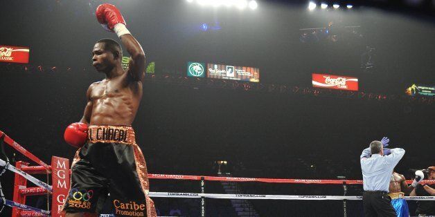 Two-time Olympic gold medallist Guillermo Rigondeaux, who defected to the US from Cuba in 2007, celebrates as his knock out victory over Teon Kennedy of the US in their WBA Super Bantamweight Championship at the MGM Grand Arena on June 9, 2012 in Las Vegas, Nevada. AFP PHOTO / JOE KLAMAR (Photo credit should read JOE KLAMAR/AFP/GettyImages)