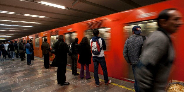 Commuters wait to board a subway train in Mexico City, Mexico, on Monday, Jan. 30, 2012. The Mexico City Metro, officially called Sistema de Transporte Colectivo, is the second largest metro system in North America after the New York City Subway. Photographer: Susana Gonzalez/Bloomberg via Getty Images