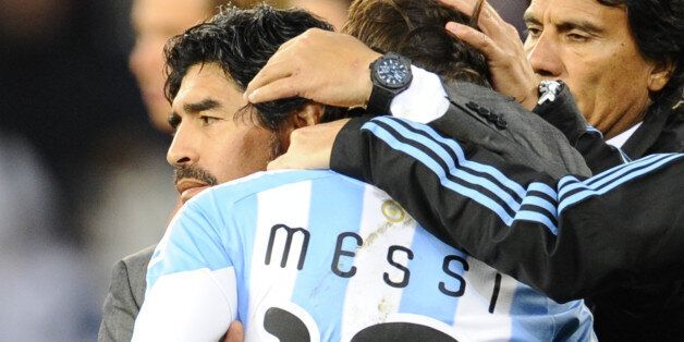 Argentina's coach Diego Maradona hugs Argentina's striker Lionel Messi after the 2010 World Cup quarter final Argentina vs Germany on July 3, 2010 at Green Point stadium in Cape Town. Germany won 4-0. NO PUSH TO MOBILE / MOBILE USE SOLELY WITHIN EDITORIAL ARTICLE - AFP PHOTO / JAVIER SORIANO (Photo credit should read DANIEL GARCIA/AFP/Getty Images)