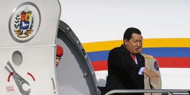 The President of Venezuela Hugo Chavez gets off the presidential plane upon arrival at the Mariscal Sucre Airport, in Quito, on May 23, 2009. Chavez is on a two day visit to Quito to strengthen energy and politic ties and to attend celebrations of the 187th anniversary of the Battle of Pichincha. AFP PHOTO/Pablo Cozzaglio (Photo credit should read PABLO COZZAGLIO/AFP/Getty Images)