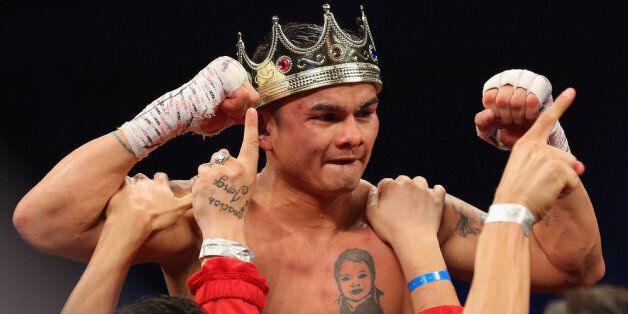 SAN ANTONIO, TX - DECEMBER 14: Marcos Maidana celebrates his unanimous decision against Adrien Broner becoming the new WBA Welterweight Title champion at Alamodome on December14, 2013 in San Antonio, Texas.during their bout at Alamodome on December 14, 2013 in San Antonio, Texas. (Photo by Ronald Martinez/Getty Images)