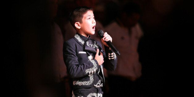 SAN ANTONIO, TX - JUNE 13: Singer Sebastien De La Cruz performs the United States national anthem before Game Four of the 2013 NBA Finals between the San Antonio Spurs and the Miami Heat at the AT&T Center on June 13, 2013 in San Antonio, Texas. NOTE TO USER: User expressly acknowledges and agrees that, by downloading and or using this photograph, User is consenting to the terms and conditions of the Getty Images License Agreement. (Photo by Christian Petersen/Getty Images)