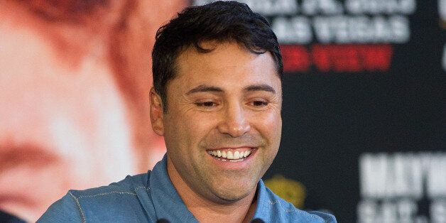 HOUSTON, TX - JULY 01: Oscar De La Hoya speaks during a press conference along with Canelo Alvarez and Floyd Mayweather Park to discuss their Super Welterweight World Championship fight July 1, 2013 at Union Station at Minute Maid Park in Houston, Texas. Floyd Mayweather and Canelo Alvarez are scheduled to fight September 14 at the MGM Grand Garden Arena in Las Vegas, Nevada. (Photo by Bob Levey/Getty Images)