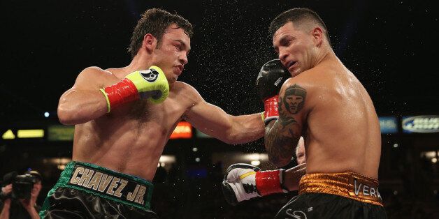 LOS ANGELES, CA - SEPTEMBER 28: Julio Cesar Chavez Jr. (L) lands a left hand to the head of Brian Vera during their Light Heavyweight bout at StubHub Center on September 28, 2013 in Los Angeles, California. (Photo by Jeff Gross/Getty Images)