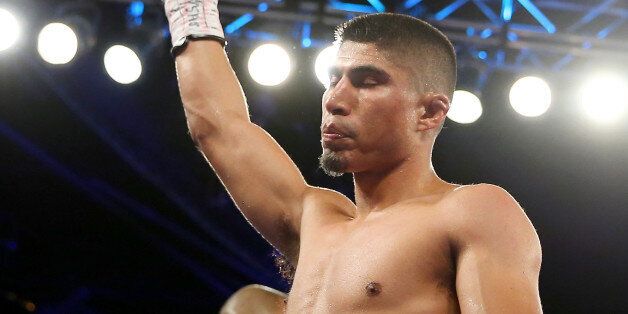 NEW YORK, NY - JANUARY 25: Mikey Garcia celebrates his win over Juan Carlos Burgos during the WBO Junior Lightweight title match at Madison Square Garden on January 25, 2014 in New York City. (Photo by Elsa/Getty Images)
