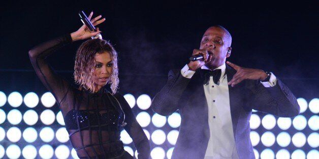 Beyonce Knowles and Jay-Z perform on stage for the 56th Grammy Awards at the Staples Center in Los Angeles, California, January 26, 2014. AFP PHOTO FREDERIC J. BROWN (Photo credit should read FREDERIC J. BROWN/AFP/Getty Images)