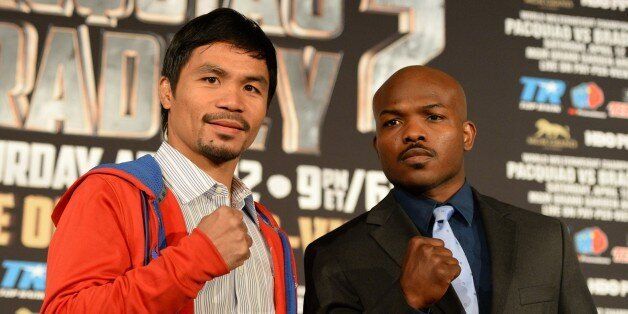 Manny Pacquiao (L) of the Philippines and Tim Bradley of the US pose at a news conference to promote their upcoming WBO welterweight championship boxing rematch in Beverly Hills, California, on February 4, 2014. Pacquiao and Bradley's first match on June 9, 2012 was a split decision in favor of Bradley, which ended Pacquiao's welterweight title reign as well as his seven-year, 15-bout winning streak. The rematch will take place on April 12 in Las Vegas. AFP PHOTO/JOE KLAMAR (Photo credit should read JOE KLAMAR/AFP/Getty Images)