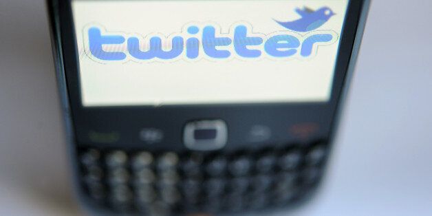 A picture taken on October 23, 2012 shows the screen of a blackberry phone reading the name of micro-blogging site Twitter below its logo. AFP PHOTO FRED TANNEAU (Photo credit should read FRED TANNEAU/AFP/Getty Images)