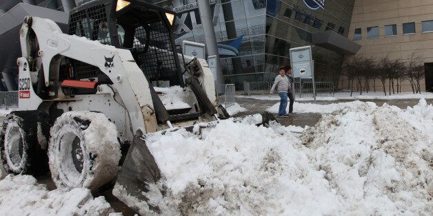 DALLAS, TX - FEBRUARY 04: A Bobcat used to plow snow sits outside the NFL Experience at the Dallas Convention Center February 4, 2011 in Dallas, Texas. More than four inches of snow fell overnight in the North Texas area. The Green Bay Packers will play the Pittsburgh Steelers in Super Bowl XLV on February 6, 2011 at Cowboys Stadium in Arlington, Texas. (Photo by Rob Carr/Getty Images)