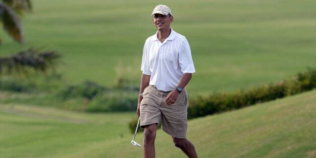 US President Barack Obama walks to 18th green as he plays golf at Mid-Pacific Country Club in Kailua, Hawaii, on January 1, 2014. The first family is in Hawaii for their annual winter vacation. AFP PHOTO/Jewel SAMAD (Photo credit should read JEWEL SAMAD/AFP/Getty Images)
