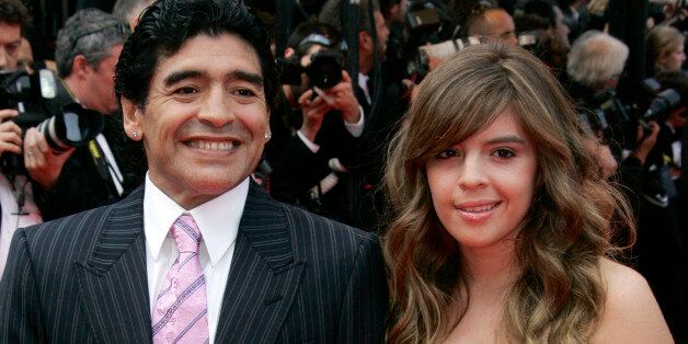Former Argentine soccer player Diego Maradona and his daughter Dalma arrive for the premiere of the film "Che" at the 61st international Cannes film festival, on Wednesday, May 21, 2008. (AP Photo/Francois Mori)