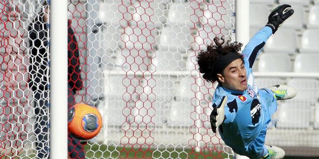 Ajaccio's Mexican goalkeeper Guillermo Ochoa concedes a goal during the French L1 football match Ajaccio (ACA) against Lille (LOSC) on March 2, 2014 at the Francois Coty stadium in Ajaccio, French Mediterranean Island of Corsica. AFP PHOTO / PASCAL POCHARD-CASABIANCA (Photo credit should read PASCAL POCHARD CASABIANCA/AFP/Getty Images)