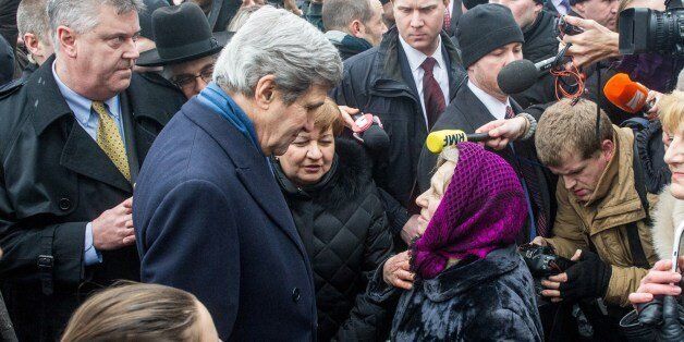 US Secretary of State John Kerry speaks to people at the Shrine of the Fallen in Kiev on March 4, 2014. The Shrine of the Fallen, located on Institutska Street, honors the fallen 'Heroes' of the 'Heavenly Sotnya' (Hundred). Over the course of the EuroMaidan protests, almost 100 protesters were killed by police. Most of them died on February 20 killed by sniper or automatic weapons fire on Institutska Street. US Secretary of State John Kerry arrived in Kiev Tuesday for talks with Ukraine's new interim government, amid an escalating crisis in Crimea. His visit came as the United States said it would provide $1 billion to financially-stricken Ukraine as part of an international loan. With the Black Sea peninsula of Crimea under near complete control by pro-Russian forces, US officials said Moscow could face sanctions within days. AFP AFP PHOTO/ VOLODYMYR SHUVAYEV (Photo credit should read VOLODYMYR SHUVAYEV/AFP/Getty Images)