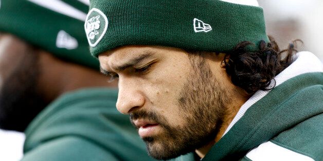 EAST RUTHERFORD, NJ - DECEMBER 1: Mark Sanchez #6 of the New York Jets walk on the sidelines against the Miami Dolphins during their game at MetLife Stadium on December 1, 2013 in East Rutherford, New Jersey. (Photo by Jeff Zelevansky/Getty Images)
