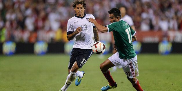 COLUMBUS, OH - SEPTEMBER 10: Jermaine Jones #13 of the United States Men's National Team battles for control of the ball with JesÃºs Zavala #17 of the Mexico Men's National Team at Columbus Crew Stadium on September 10, 2013 in Columbus, Ohio. (Photo by Jamie Sabau/Getty Images)
