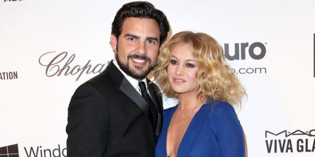LOS ANGELES, CA - MARCH 02: Singers Paulina Rubio (R) and Gerardo Bazua attend the 22nd Annual Elton John AIDS Foundation's Oscar Viewing Party on March 2, 2014 in Los Angeles, California. (Photo by Frederick M. Brown/Getty Images)