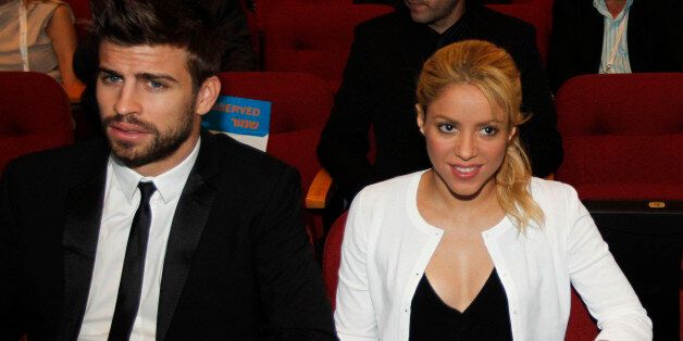 FILE - This June 21, 2011 file photo shows Colombian singer Shakira with her boyfriend FC Barcelona Gerard Pique, left, during a plenary session at the President's Conference in Jerusalem. Shakira promoted her global education campaign with a stop at a joint Israeli-Arab school in Jerusalem on. Shakira is pregnant with her first child. The 35-year-old posted on her website Wednesday that she and boyfriend Gerard Pique ?are very happy awaiting the arrival of our first baby.? Pique, who is from Barcelona, is a soccer player for FC Barcelona. (AP Photo/Tara Todras-Whitehill, Pool)