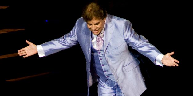 Mexican singer Juan Gabriel, performs during his latest tour entitled "Gala Encounter with Juan Gabriel" in Guadalajara, Mexico, Friday, Sept. 25, 2009.(AP Photo/Carlos Jasso)