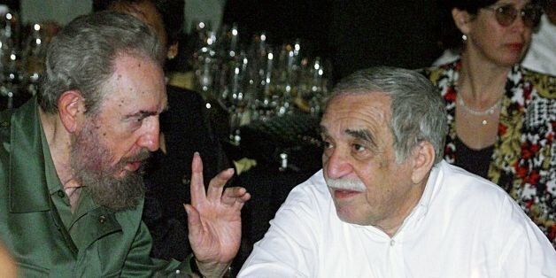 HAVANA, CUBA: Cuban President Fidel Castro (L) talks with the Colombian Nobel Laureate of Literature, Gabriel Garcia Marquez, during a dinner at the closing of the Cuban Cigars Festival in Havana, Cuba, 04 March 2000. Castro and Marquez witnessed the auction of special boxes for Cuban cigars, which collected a sum of US$ 523,000 to be used to buy medicine for children's hospitals. (ELECTRONIC IMAGE) AFP PHOTO/ADALBERTO ROQUE (Photo credit should read ADALBERTO ROQUE/AFP/Getty Images)