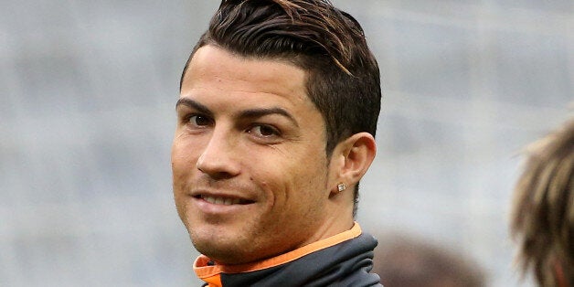 MUNICH, GERMANY - APRIL 28: Cristiano Ronaldo of Real Madrid warms up during the training session on the eve of the UEFA Champions League semi final second leg match between FC Bayern Muenchen and Real Madrid CF at Allianz Arena on April 28, 2014 in Munich, Bavaria, Germany. (Photo by Jean Catuffe/Getty Images)