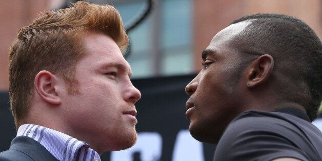 LOS ANGELES, CA - MAY 06: Boxers Canelo Alvarez (L) and Erislandy Lara face off onstage prior to the press conference for Canelo Alvarez v Erislandy Lara on May 6, 2014 in Los Angeles, California. (Photo by Victor Decolongon/Getty Images)