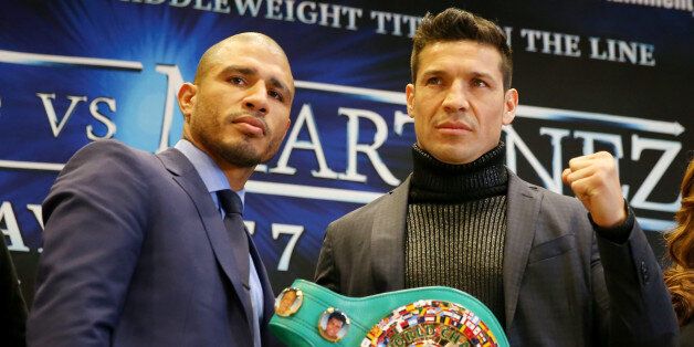 NEW YORK, NY - MARCH 11: Miguel Cotto and Sergio Martinez pose with the WBC belt during a press conference in Chase Square at Madison Square Garden on March 11, 2014 in New York City. Cotto and Martinez will square off at Madison Square Garden on June 7, 2014. (Photo by Elsa/Getty Images)