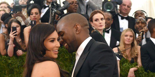 Kanye West (R) and Kim Kardashian arrive at the Costume Institute Benefit at The Metropolitan Museum of Art May 5, 2014 in New York. AFP PHOTO/Timothy A. CLARY (Photo credit should read TIMOTHY A. CLARY/AFP/Getty Images)