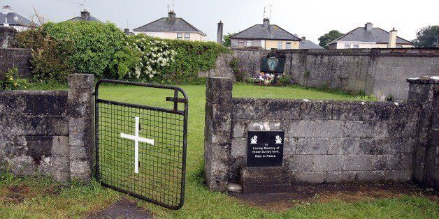 This picture shows a shrine in Tuam, County Galway on June 9, 2014, erected in memory of up to 800 children who were allegedly buried at the site of the former home for unmarried mothers run by nuns. Up to 800 babies and children were buried in a mass grave in Ireland near a home for unmarried mothers run by nuns, new research showed, throwing more light on the Irish Catholic Church's troubled past. Death records suggest 796 children, from newborns to eight-year-olds, were deposited in a grave near a Catholic-run home for unmarried mothers during the 35 years it operated from 1925 to 1961. AFP PHOTO/PAUL FAITH (Photo credit should read PAUL FAITH/AFP/Getty Images)