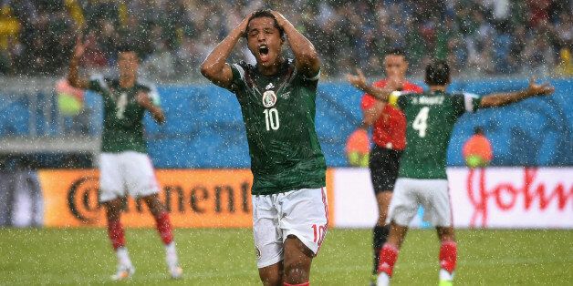 NATAL, BRAZIL - JUNE 13: Giovani dos Santos of Mexico reacts after his goal was disallowed due to an offsides call in the first half during the 2014 FIFA World Cup Brazil Group A match between Mexico and Cameroon at Estadio das Dunas on June 13, 2014 in Natal, Brazil. (Photo by Matthias Hangst/Getty Images)