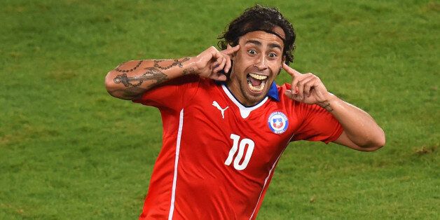 CUIABA, BRAZIL - JUNE 13: Jorge Valdivia of Chile celebrates after scoring the teams second goal during the 2014 FIFA World Cup Brazil Group B match between Chile and Australia at Arena Pantanal on June 13, 2014 in Cuiaba, Brazil. (Photo by Stu Forster/Getty Images)