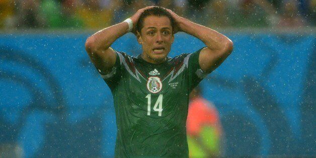 Mexico's forward Javier Hernandez reacts during the Group A football match between Mexico and Cameroon at the Dunas Arena in Natal during the 2014 FIFA World Cup on June 13, 2014. AFP PHOTO / YURI CORTEZ (Photo credit should read YURI CORTEZ/AFP/Getty Images)