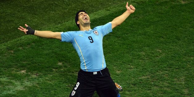 SAO PAULO, BRAZIL - JUNE 19: Luis Suarez of Uruguay celebrates after scoring his team's second goal during the 2014 FIFA World Cup Brazil Group D match between Uruguay and England at Arena de Sao Paulo on June 19, 2014 in Sao Paulo, Brazil. (Photo by Matthias Hangst/Getty Images)