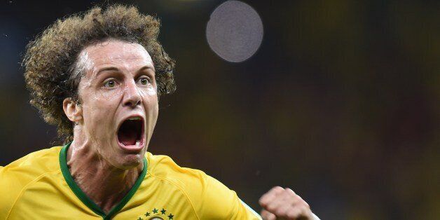 Brazil's defender David Luiz celebrates scoring during the quarter-final football match between Brazil and Colombia at the Castelao Stadium in Fortaleza during the 2014 FIFA World Cup on July 4, 2014. AFP PHOTO / VANDERLEI ALMEIDA (Photo credit should read VANDERLEI ALMEIDA/AFP/Getty Images)