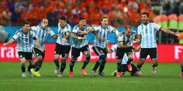 SAO PAULO, BRAZIL - JULY 09: Lionel Messi, Pablo Zabaleta, Martin Demichelis, Marcos Rojo, Lucas Biglia, Javier Mascherano, Rodrigo Palacio and Ezequiel Garay of Argentina celebrate defeating the Netherlands in a shootout during the 2014 FIFA World Cup Brazil Semi Final match between the Netherlands and Argentina at Arena de Sao Paulo on July 9, 2014 in Sao Paulo, Brazil. (Photo by Ronald Martinez/Getty Images)