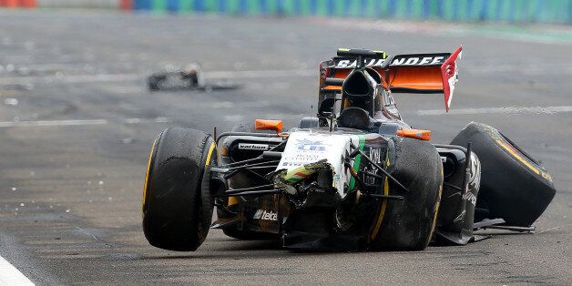 BUDAPEST, HUNGARY - JULY 27: Sergio Perez of Mexico and Force India wa;lks away from his car after crashing during the Hungarian Formula One Grand Prix at Hungaroring on July 27, 2014 in Budapest, Hungary. (Photo by Mark Thompson/Getty Images)