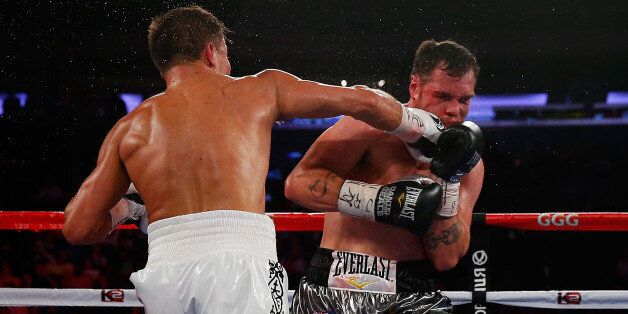NEW YORK, NY - JULY 26: Gennady Golovkin lands a punch to knocks out Daniel Geale in the third round to win the WBA/IBO middleweight championship at Madison Square Garden on July 26, 2014 in New York City. (Photo by Mike Stobe/Getty Images)