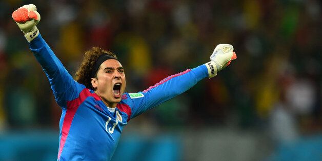 RECIFE, BRAZIL - JUNE 23: Guillermo Ochoa of Mexico celebrates his team's first goal during the 2014 FIFA World Cup Brazil Group A match between Croatia and Mexico at Arena Pernambuco on June 23, 2014 in Recife, Brazil. (Photo by Jamie McDonald/Getty Images)