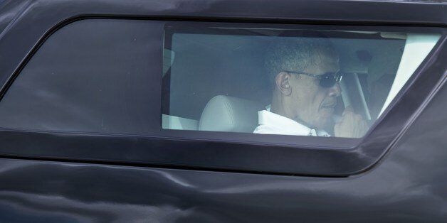 US President Barack Obama is driven to Marine One at Andrews Air Force Base on August 2, 2014 in Maryland. Obama spent the day at Andrews playing golf before traveling to Camp David for the evening. AFP PHOTO/Brendan SMIALOWSKI (Photo credit should read BRENDAN SMIALOWSKI/AFP/Getty Images)