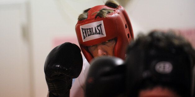 MILLERSVILLE, MD - SEPTEMBER 16, 2010. David Opie, 49, a physicist by day and a boxer by night, trains at Club One Fitness. He is part of a nation-wide program called White Collar Boxing, which is what it sounds like: people who sit behind a desk all day getting in the ring to spar. (Photo by ASTRID RIECKEN For The Washington Post via Getty Images)