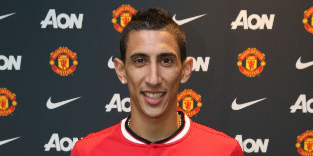 MANCHESTER, ENGLAND - AUGUST 26: (EXCLUSIVE COVERAGE) (MINIMUM FEES APPLY - 150 GBP PRINT & 75 GBP ONLINE OR LOCAL EQUIVALENT, PER IMAGE) Angel di Maria of Manchester United poses after signing for the club at Aon Training Complex on August 26, 2014 in Manchester, England. (Photo by John Peters/Man Utd via Getty Images)