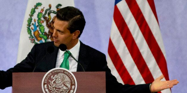 Mexico's President Enrique Pena Nieto speak during a news conference that concluded the North American Leaders Summit in Toluca, Mexico, Wednesday, Feb. 19, 2014. The leaders of the three North American Free Trade Agreement (NAFTA) nations met in part to highlight the economic cooperation that has grown since NAFTA joined the U.S., Canada and Mexico 20 years ago. (AP Photo/Eduardo Verdugo)
