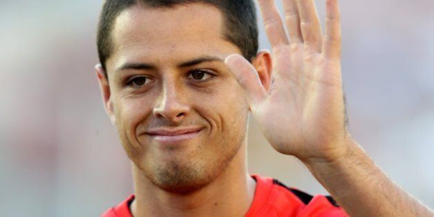 PASADENA, CA - JULY 23: Mexico star Javier 'Chicharito' Hernandez of Manchester United waves to fans as he trains before the game with the Los Angeles Galaxy at the Rose Bowl on July 23, 2014 in Pasadena, California. (Photo by Stephen Dunn/Getty Images)