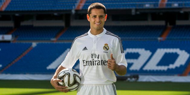 Mexico international soccer player Javier Hernandez 'Chicharito', poses during his official presentation at the Santiago Bernabeu stadium in Madrid, Spain, Monday, Sept. 1, 2014, after signing for Real Madrid. (AP Photo/Andres Kudacki)